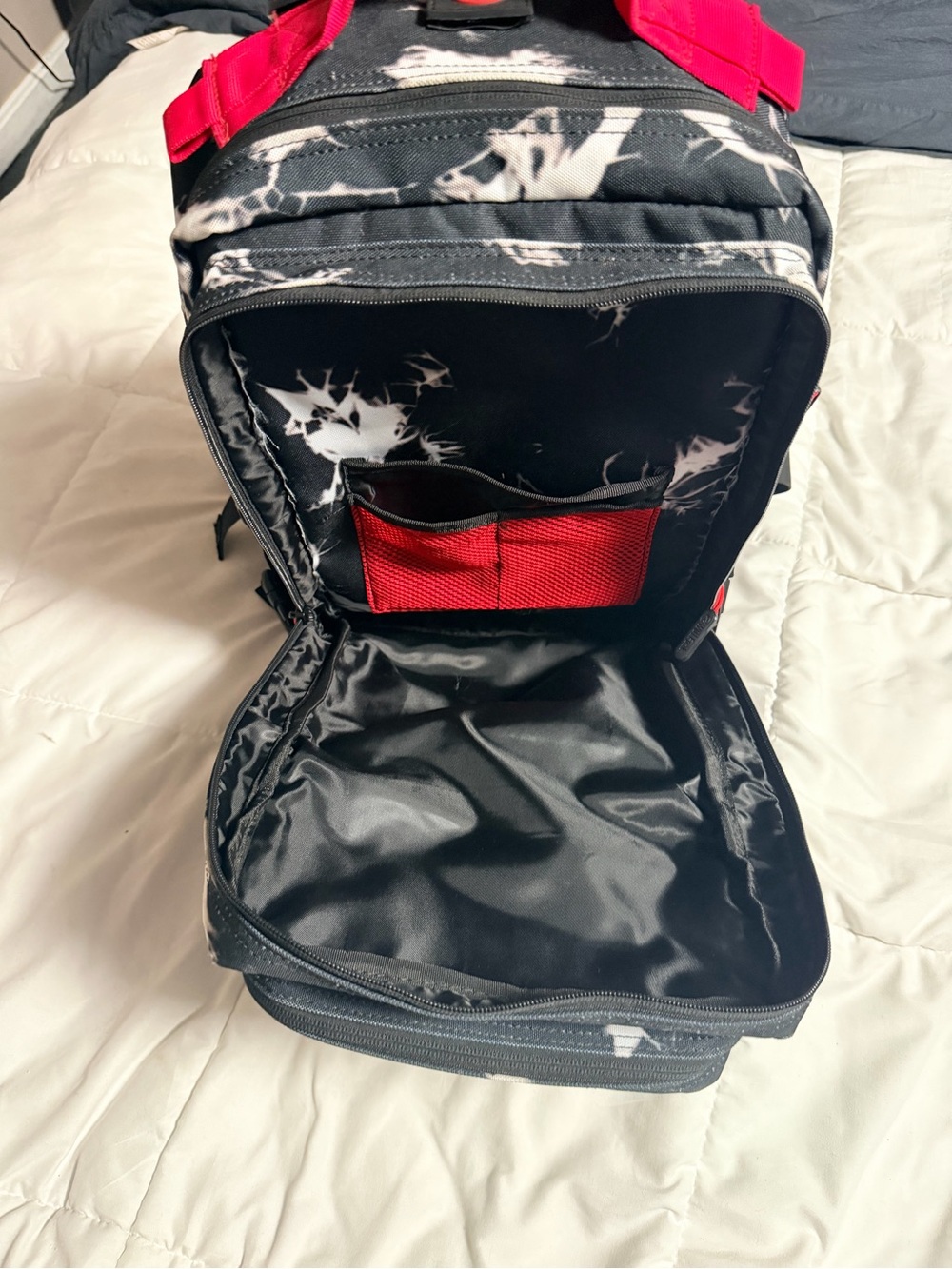 WOLF Black Backpack with Red Accents and White Marble Print